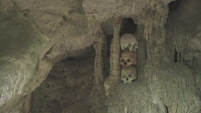 Tampang Allo, Tana Toraja, Indonesia - Tau Tau Human Skulls Piles of Bones Burial Graves Cave