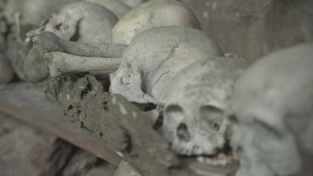 Tampang Allo, Tana Toraja, Indonesia - Tau Tau Human Skulls Piles of Bones Burial Graves Cave
