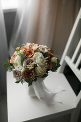 Wedding bouquet on a chair ..