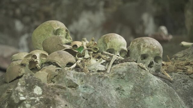 Tampang Allo, Tana Toraja, Indonesia - Tau Tau Human Skulls Piles of Bones Burial Graves Cave