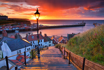 Dramatic Sunset at Whitby after a shower on a Summer Evening. North Yorkshire, England, UK. - obrazy, fototapety, plakaty
