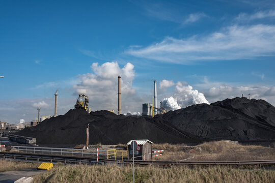 Huge mountains of coal are necessary to keep the kilns burning at Tata Steel. Wijk aan Zee, Noord-Holland province, The Netherlands