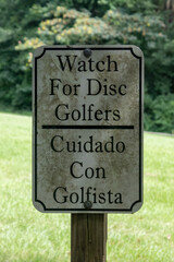 watch for disc golfers sign at the park