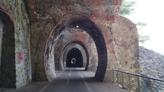Italy, Spezia, Liguria - The new pedestrian walk , cycle path ( bicycle lane ) that connects Framura, Bonassola and Levanto passing through the ancient train tunnels