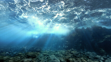 Fototapeta na wymiar Magic rays of sunlight over the reef