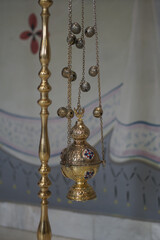 Fototapeta na wymiar Hanging icon lamp in orthodox church. Orthodox icon lamp. Church attribute. Lamp stand Church
