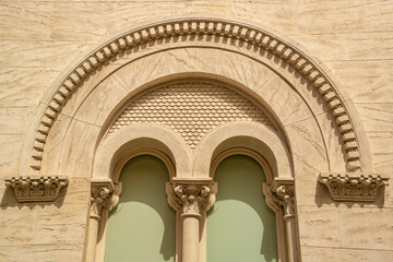 Window with Ionic stone arch