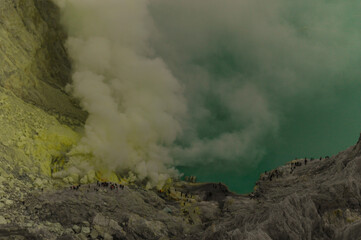 Ijen volcano with crater lake Kawah Ijen with active solfataras, sulfur volcano | Java Island, Indonesia