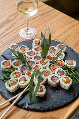 sushi and white wine in restaurant