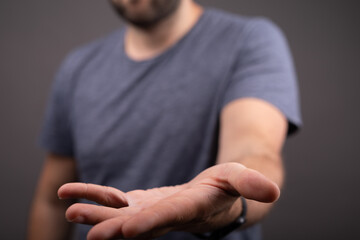 man mid section with hand out
