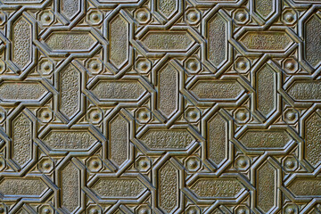 Islamic pattern on a metal surface of an ancient door