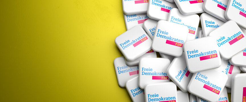 Logos Of The Liberal German Political Party FDP On A Heap On A Table. Copy Space. Web Banner Format.