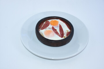 bacon eggs in casserole served with white plate