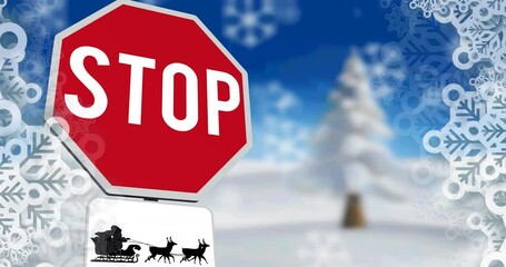Animation of snowflakes over stop sign with santa claus in sleigh with reindeer in winter scenery - Powered by Adobe