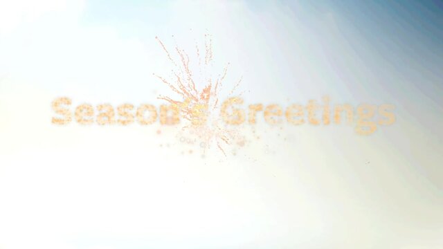 Seasons greeting text over fireworks exploding against gradient blue background