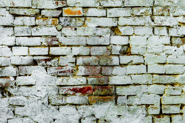 Texture of a brick wall with cracks and scratches which can be used as a background