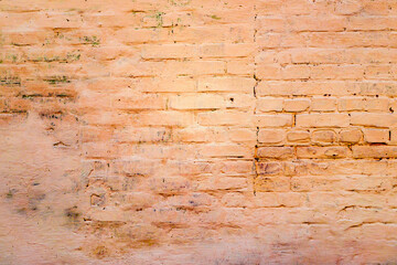 Texture of a brick wall with cracks and scratches which can be used as a background