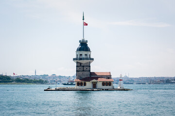 Fototapeta na wymiar The historical Maiden's Tower, one of the symbols of Istanbul. Maiden's Tower on the Bosphorus in Üsküdar. View of Maiden's Tower and Sarayburnu. Bosphorus and Maiden's Tower view.