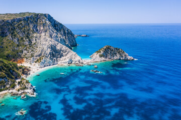 Aerial view Agia Eleni beach in Kefalonia Island, Greece. Remote beautiful rocky beach with clear emerald water and high white cliffs