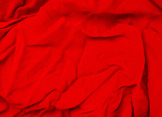 crumpled red fabric texture closeup