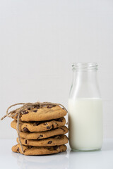 Cookies and milk against white background