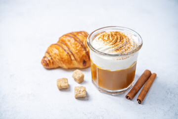 Pumpkin spiced Latte Coffee with whipped cream in a glass