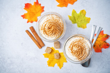 Pumpkin spiced Latte Coffee with whipped cream in a glass
