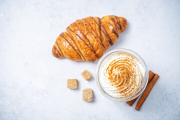 Pumpkin spiced Latte Coffee with whipped cream in a glass