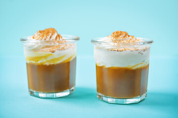 Pumpkin spiced Latte Coffee with whipped cream in a glass