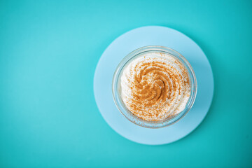 Pumpkin spiced Latte Coffee with whipped cream in a glass