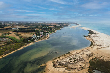 Aerial view of Praia da Fabrica, also known as Praia de Cacela Velha beach, a sandy barrier island...