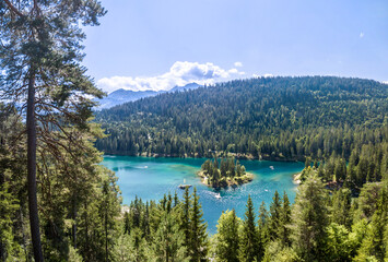 Naklejka premium Aerial image of the turquoise Caumasee lake in the alpine mountains in Flims, Grisons, Switzerland