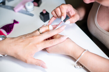 Obraz na płótnie Canvas nail decorations with special uv gel