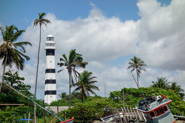 Mandacaru lighthouse and boats in the small village in Barreirinhas, Maranhao, Brazil