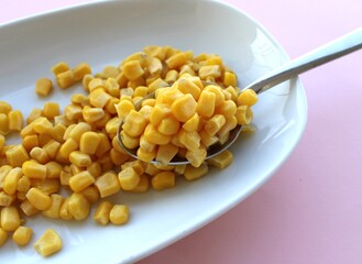 Cooked corn seeds on the plate, boiled sweet corn