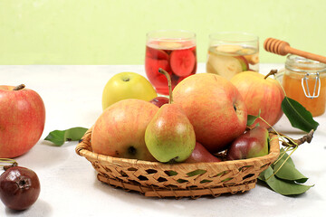 Apple and pear cider, juice or fruit drink and ingredients on a sunny table. The concept of diet and weight loss. Apples help cleanse the body and reduce weight. Healthy eating,