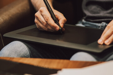 Close Up of a Person Drawing on a Graphics Tablet