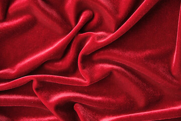 Obraz premium abstract texture of draped red velvet background. eautiful textile backdrop. Close-up. Top view