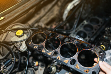 Fototapeta na wymiar engine gasket, replacement of the cylinder block and head gasket.