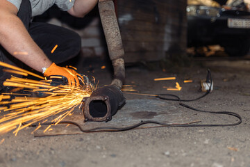 Removing the catalytic converter from the muffler of the vehicle, the catalytic converter filters...