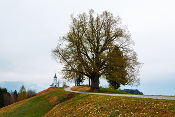 On the hilltop the magnificent Church of St. Primus and St. Felician with beautiful views of the landscape, Jamnik village, Kranj village, Triglav National Park