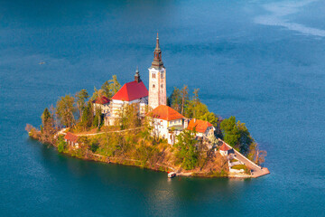 Lake Bled in the middle of the island with the church at sunset in the Triglav National Park,...