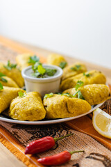 colombian empanadas with aji and lemon, vertical photo