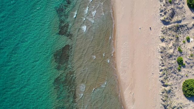 High angle view of Chalikounas beach on a land strip between Lake Korission and Ionian Sea on Corfu Island in Greece, 4k video