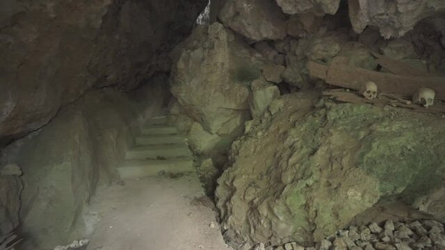 Tampang Allo, Tana Toraja, Indonesia - Tau Tau Human Skulls Piles of Bones Burial Graves Cave