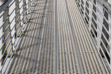 Metal walkway in a boat harbor.