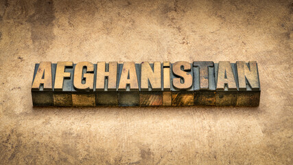 Afghanistan word abstract in vintage letterpress wood type printing blocks against abstract textured bark paper