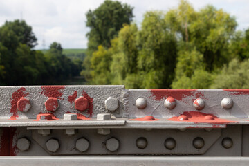 Bridge railing connected with bolt, nut and rivet painted with primer paint