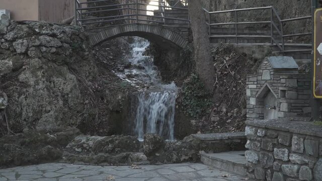 zoom in at a small creek close to Edessa waterfalls at a cloudy day