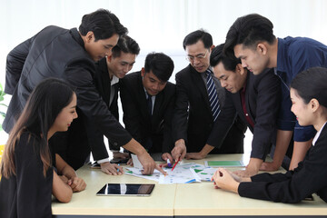 Business People Analyzing Statistics Financial Concept or Business People Meeting Conference Discussion Corporate Concept or Teamwork with business people analysis cost graph on desk at meeting room.
